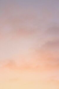 A serene and colorful sunset sky featuring soft pastel hues, perfect for nature and sky-themed content.